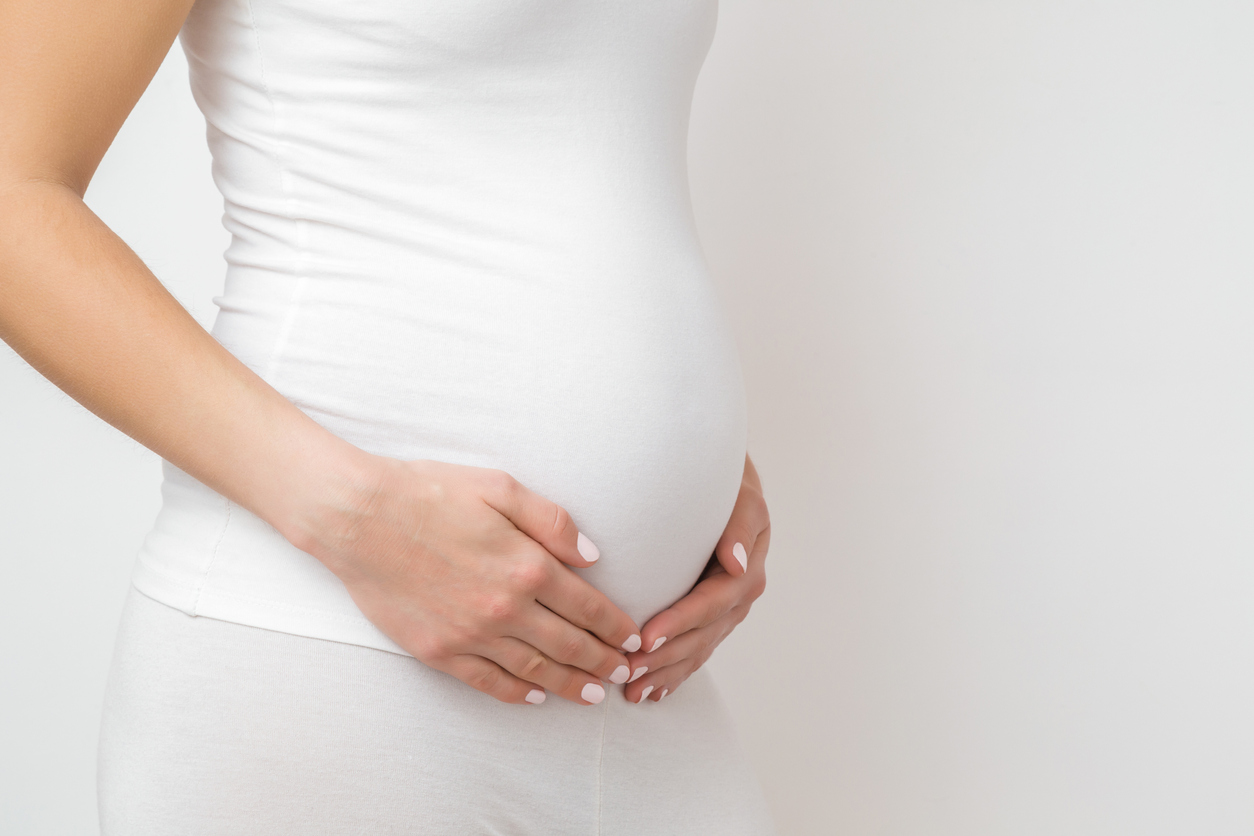 Pregnant woman wearing white. Are dental x-rays while pregnant safe?
